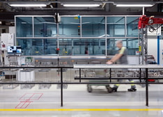 A man walking in a modern production environment