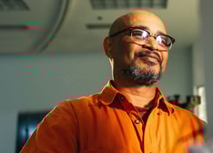 A man looking at a screen