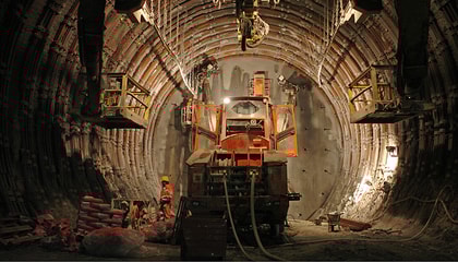 Axera T12-Sedrun drilling jumbo in action in the tunnel