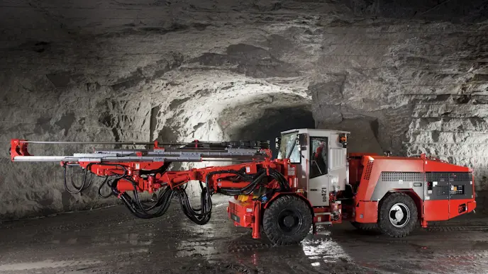 A development drill rig in an underground mine
