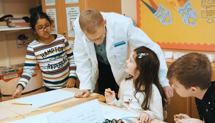 Anders Hoel and children at the British International School of Stockholm.