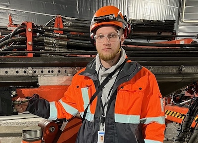 Summerworker Andreas Osara wearing safety clothing in a manufacturing environment