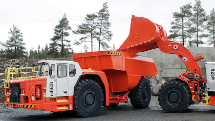 A Sandvik truck and loader in a quarry