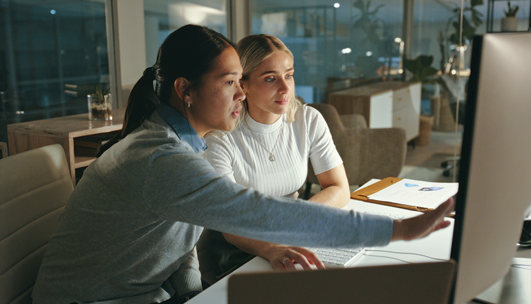 Two woman looking at a screen