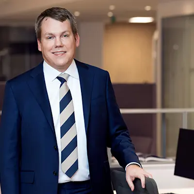 Stefan Widing standing in an office environment